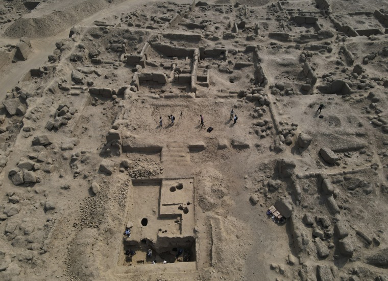 Archaeologist work at the Cajamarquilla complex near Lima, Peru, on Feb. 13, 2022. 