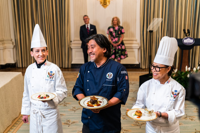 From left, Susie Morrison, Edward Lee, and Cris Comerford, display the dishes to be served at the State Dinner at the White House