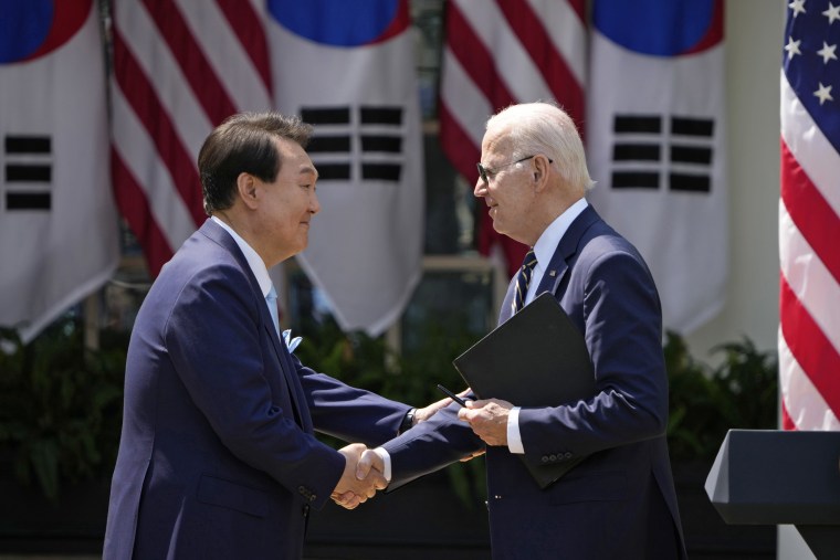 President Joe Biden and South Korean President Yoon Suk-yeol shake hands during a joint press conference in the Rose Garden at the White House on April 26, 2023.