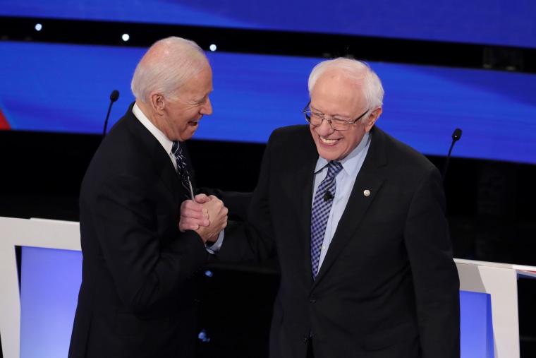 Joe Biden and Bernie Sanders at the Democratic presidential primary debate in Des Moines, Iowa