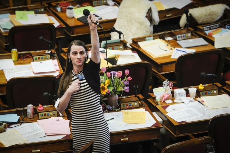Rep. Zooey Zephyr, D-Missoula, alone on the house floor stands in protest as demonstrators are arrested in the house gallery on April 24, 2023 in the Montana State Capitol. 