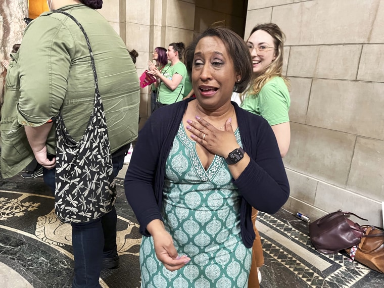 Jo Giles, executive director of the Women's Fund of Omaha, cries tears of joy inside the Nebraska State Capitol after the failure of a bill that would have banned abortion around the sixth week of pregnancy, Thursday, April 27, 2023 in Lincoln, Neb. The bill is now likely dead for the year, leaving in place a 2010 law that bans abortions at 20 weeks.(AP Photo/Margery Beck)