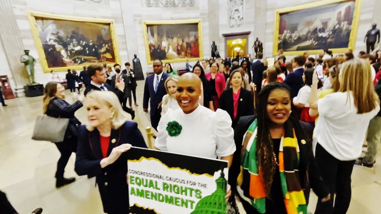 Reps. Sylvia Garcia, D-Texas, left, Ayanna Pressley, D-Mass., center, and other other Democratic members of the House protest outside the Senate Chamber for passage of the Equal Rights Amendment on April 27, 2023.