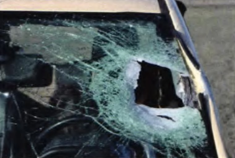 A hole in the windshield of Alexa Bartell's vehicle.