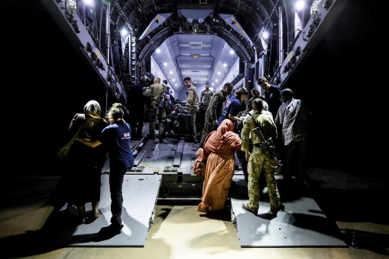 People evacuate Sudan at Wadi Seidna military airport near Khartoum on April 27, 2023.