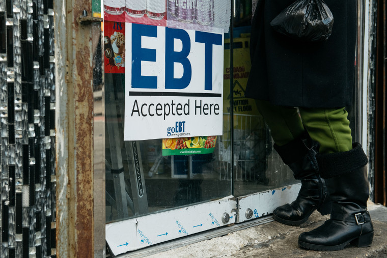 A sign alerting customers about SNAP food stamps benefits is displayed at a Brooklyn grocery store in New York City in 2019.