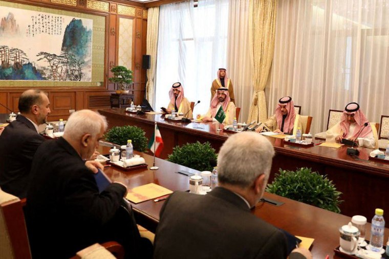 This handout picture provided by the Iranian foreign ministry shows Iran's Foreign Minister Hossein Amir-Abdollahian and Saudi Foreign Affairs Minister Prince Faisal bin Farhan attending a meeting with members of their delegations, in Beijing on April 6, 2023. 