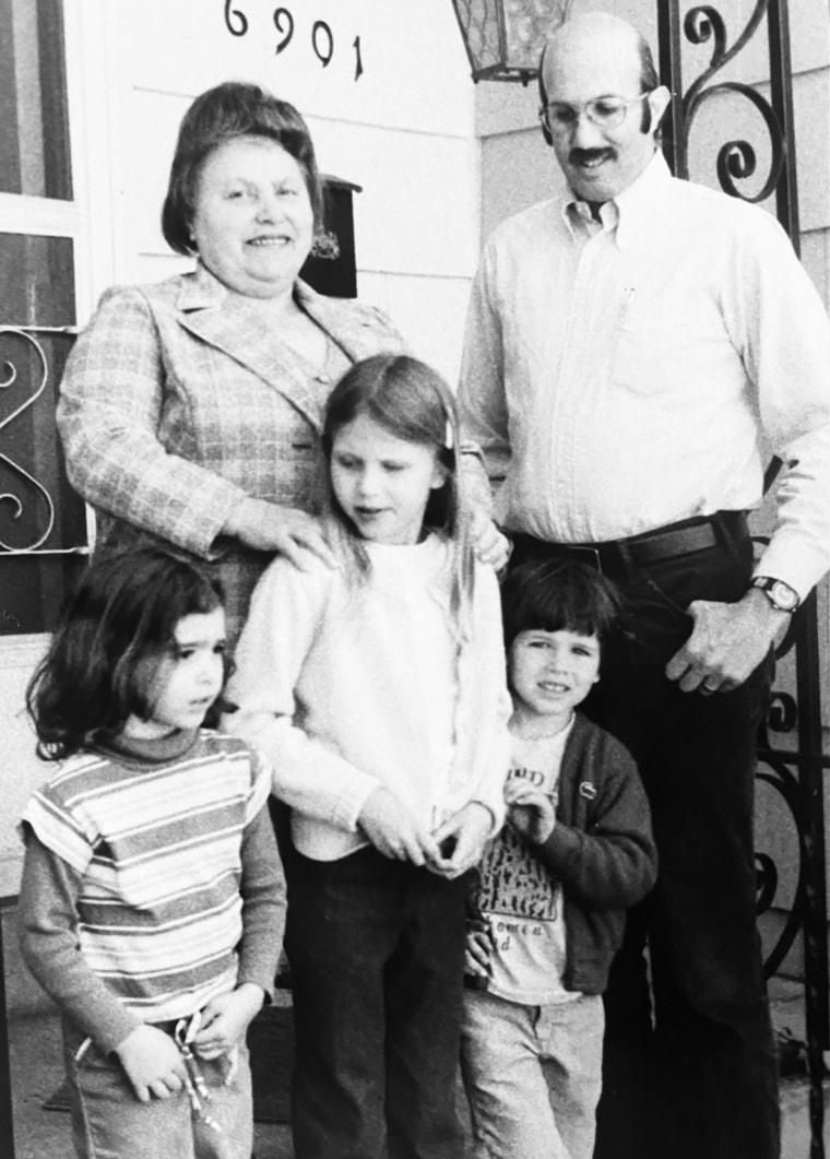 Family friend Bronia Roslawowski with me (her hands on my shoulders), my father, my brother and one of her grandchildren. 
