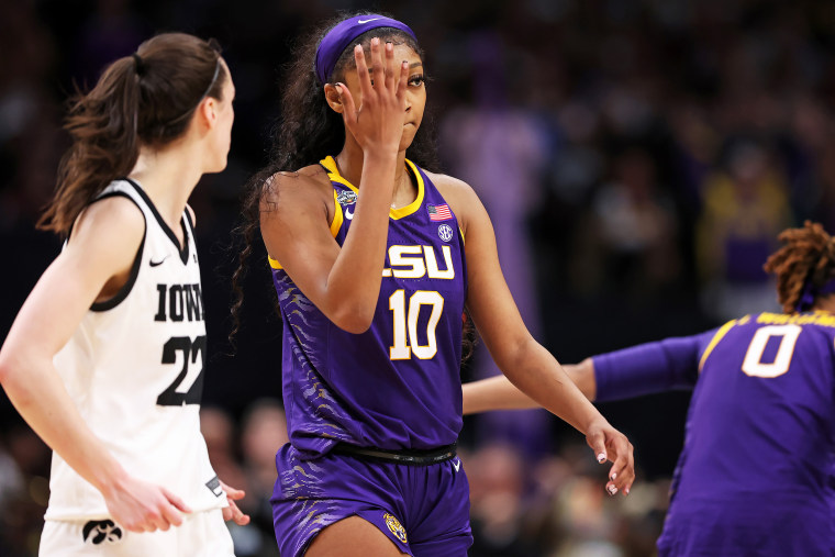 Angel Reese #10 of the LSU Lady Tigers reacts towards Caitlin Clark #22 