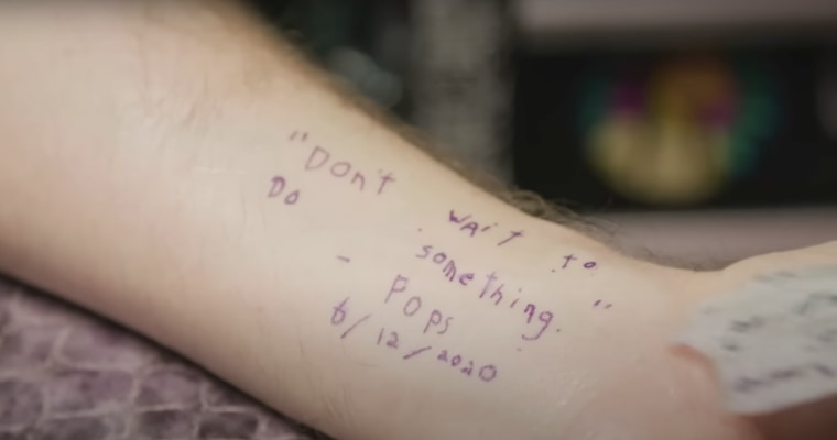 Sam Bennett shows the tattoo on his arm in his dad's handwriting.