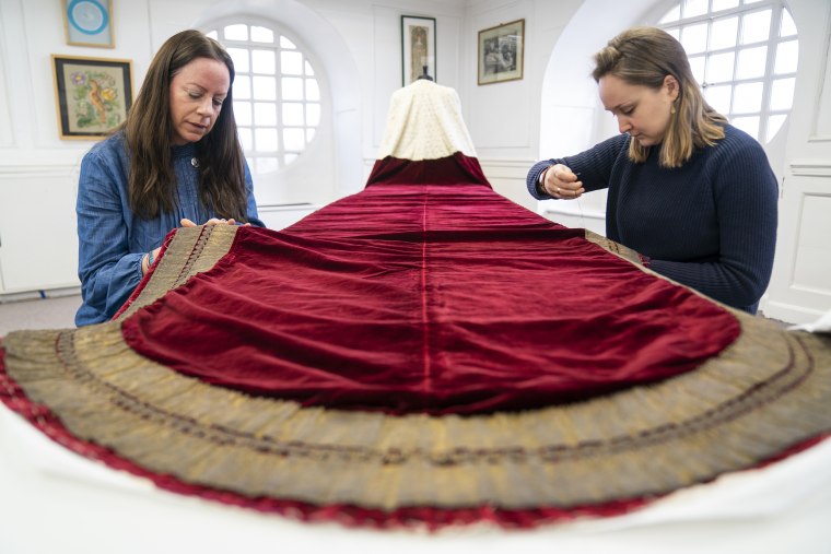 Work is carried out on King Charles III's Robe of State, which he will wear at his coronation on May 6, by members of the Royal School of Needlework, at Hampton Court Palace, in East Molesey. Picture date: Monday February 27, 2023.