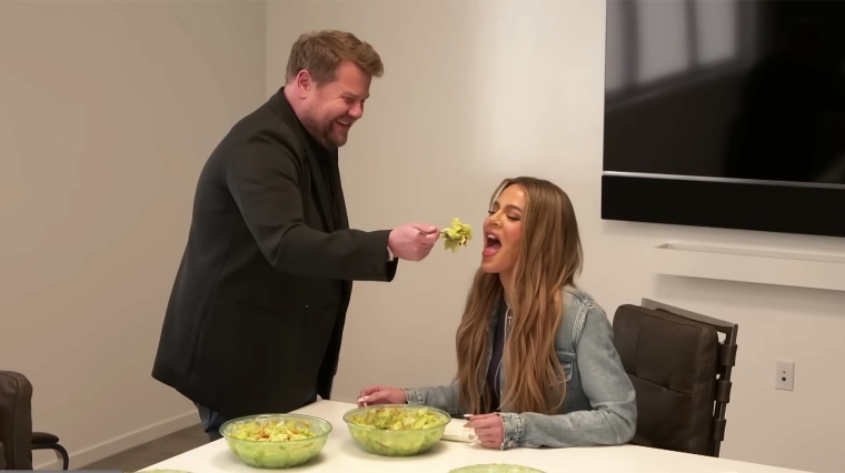 James Corden feeds Khloé Kardashian while acting as her assistant for the day.