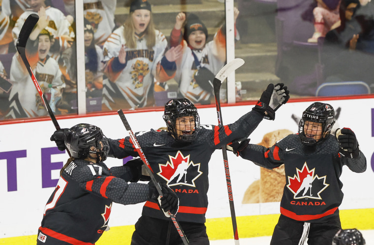 Canada forward Natalie Spooner (24) celebrates her goal with Canada defender Ella Shelton (17) and Canada forward Sarah Fillier (10). Team Canada takes on Team Switzerland on Day One of the IIHF Womens hockey tournament at the CAA Centre in Brampton. 