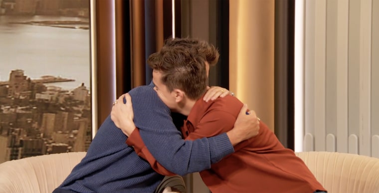 Rob Lowe embraces son John Owen Lowe after giving him his five-year sobriety chip on "The Drew Barrymore Show."