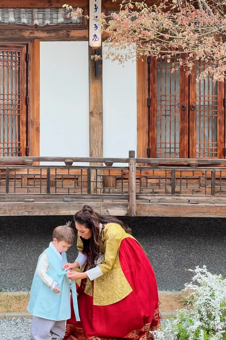 Joanna Gaines helps her son Crew dress in his traditional Korean garb.