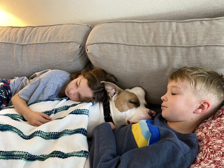 Kristen Kuhlman's kids are seen snuggling with their dog, Strawberry.