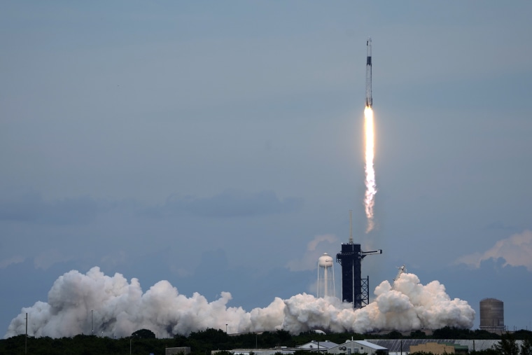 A SpaceX Falcon 9 rocket, with the Dragon capsule and a crew of four private astronauts lifts off from pad 39A, at the Kennedy Space Center in Cape Canaveral, Fla. on, Sunday. (AP Photo/John Raoux)