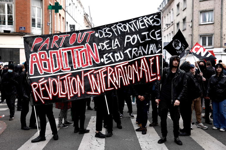 Protestors take part in a demonstration on May Day to mark the international day of the workers in Lille, France