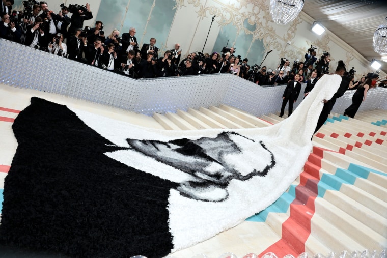 IMage: Jeremy Pope with a larger than life tribute to the man of the hour, Karl Lagerfeld.