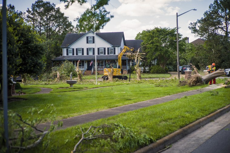 Image: Damage from Sunday's EF-3 rated tornado is cleaned up in the Great Neck area of Virginia Beach, Va., on May 1, 2023.