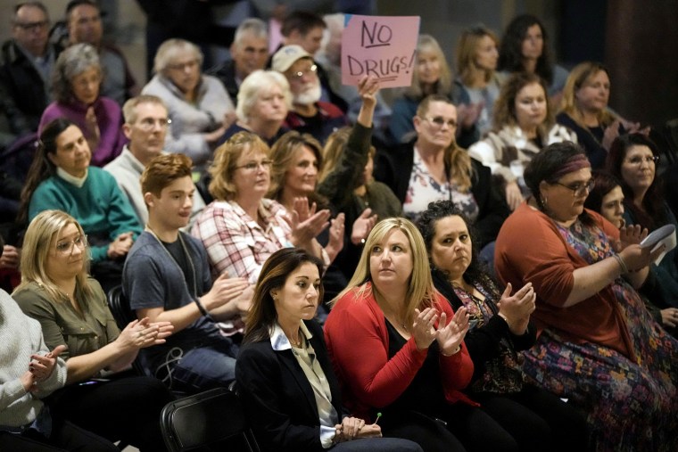People applaud during a rally in support of legislation banning gender-affirming health care for minors at the Missouri Statehouse in Jefferson City on March 20, 2023.
