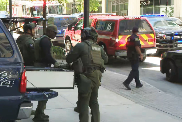 Emergency personnel work at the scene of a shooting in Atlanta