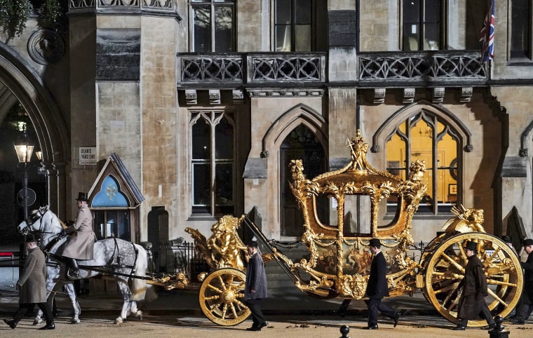 Image: The Gold State Coach is led in a procession in London on May 3, 2023, during a rehearsal for the coronation of King Charles III.