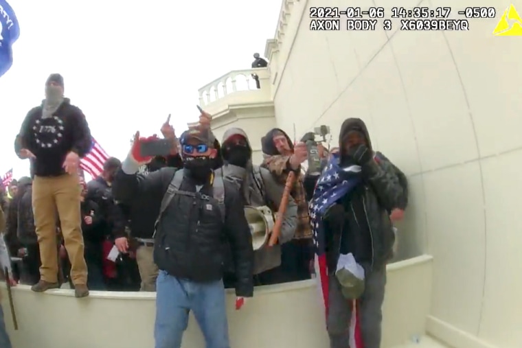 A protester uses pepper spray at the United States Capitol, on January 6, 2021.