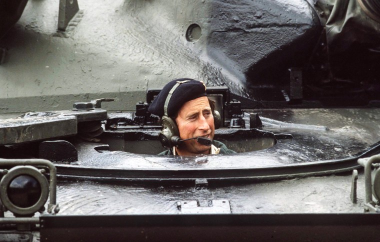 Prince Charles drives a chiefton tank at an army range In Tidworth, England, on June 12, 1985.