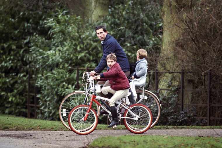 Prince Charles, Prince William and Prince Harry ride their bikes after returning from the stables at Sandringham Estate, In Norfolk.