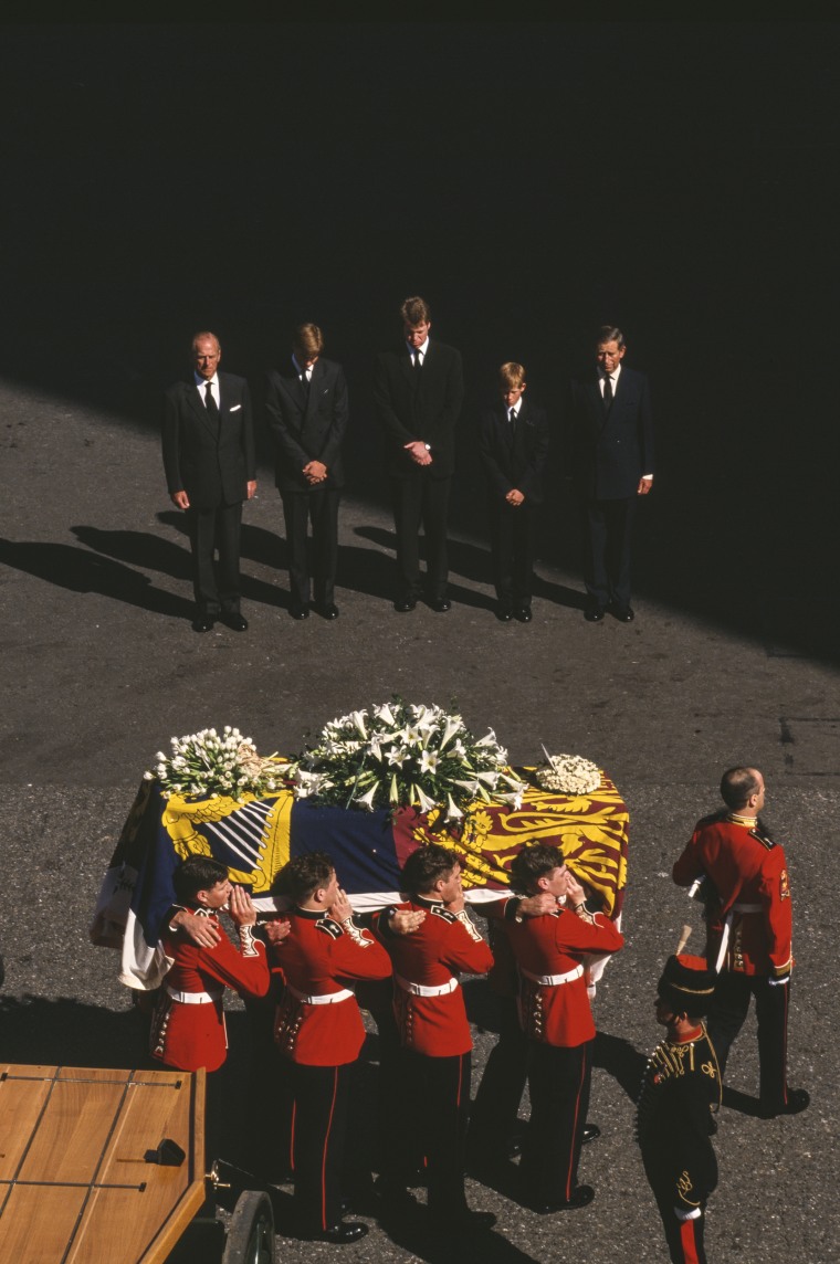 Philip, Duke of Edinburgh, Prince William, Earl Spencer, Prince Harry and Charles, Prince of Wales bow their heads behind Diana's casket during the funeral procession of Diana, Princess of Wales on Sept. 6, 1997.