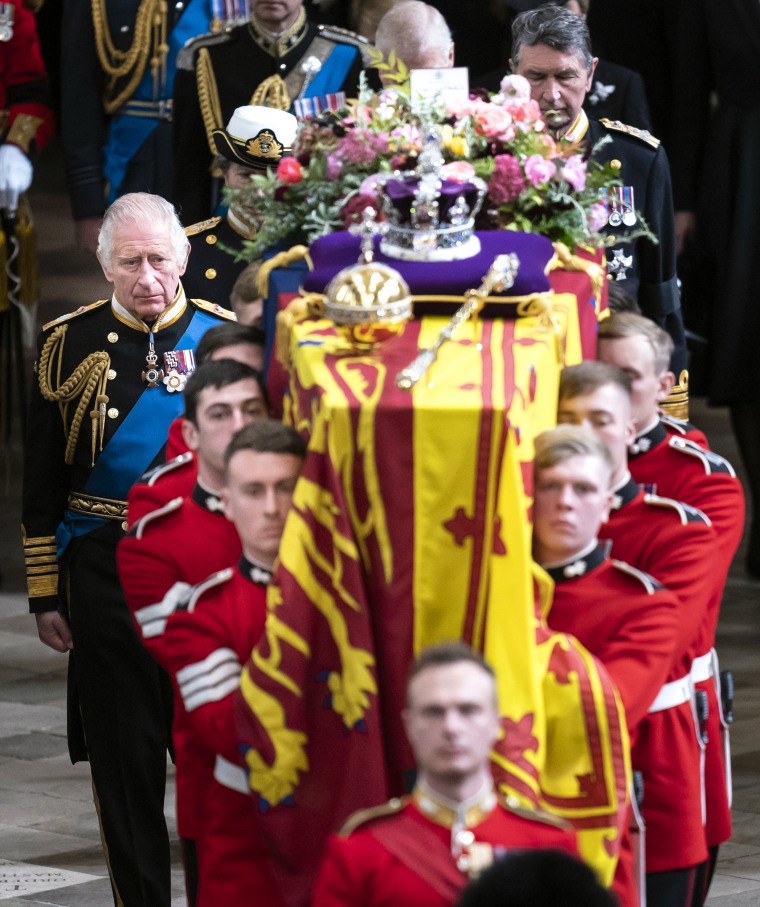 King Charles III follows behind the coffin of Queen Elizabeth II,  as it is carried out of Westminster Abbey after the State Funeral of Queen Elizabeth II on Sept. 19, 2022 in London.