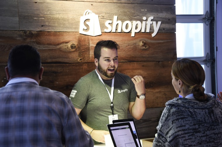 A Shopify expert speaks with attendees at Facebook's Boost Your Business event