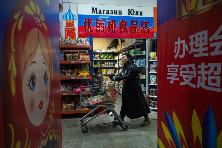 A customer at an Epinduo supermarket in Heihe, China