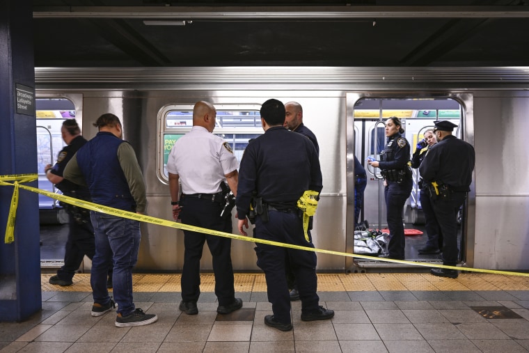 New York police officers work at a roped off Subway station, where Jordan Neely was found unconscious