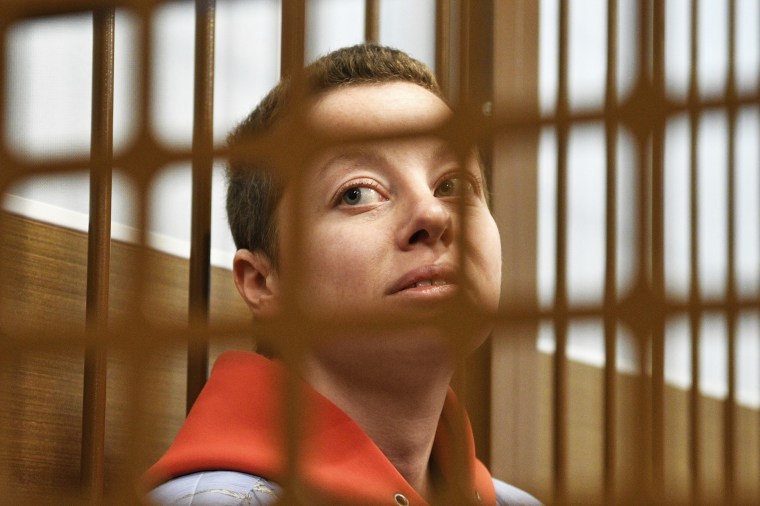 Yevgenia Berkovich sits in a cell at court in Moscow