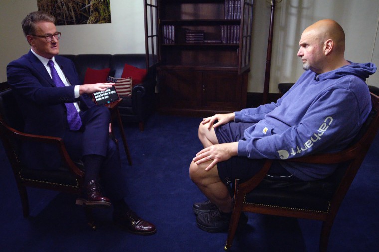 From left, Joe Scarborough interviews Sen. John Fetterman, D-Pa., on May 5, 2023.