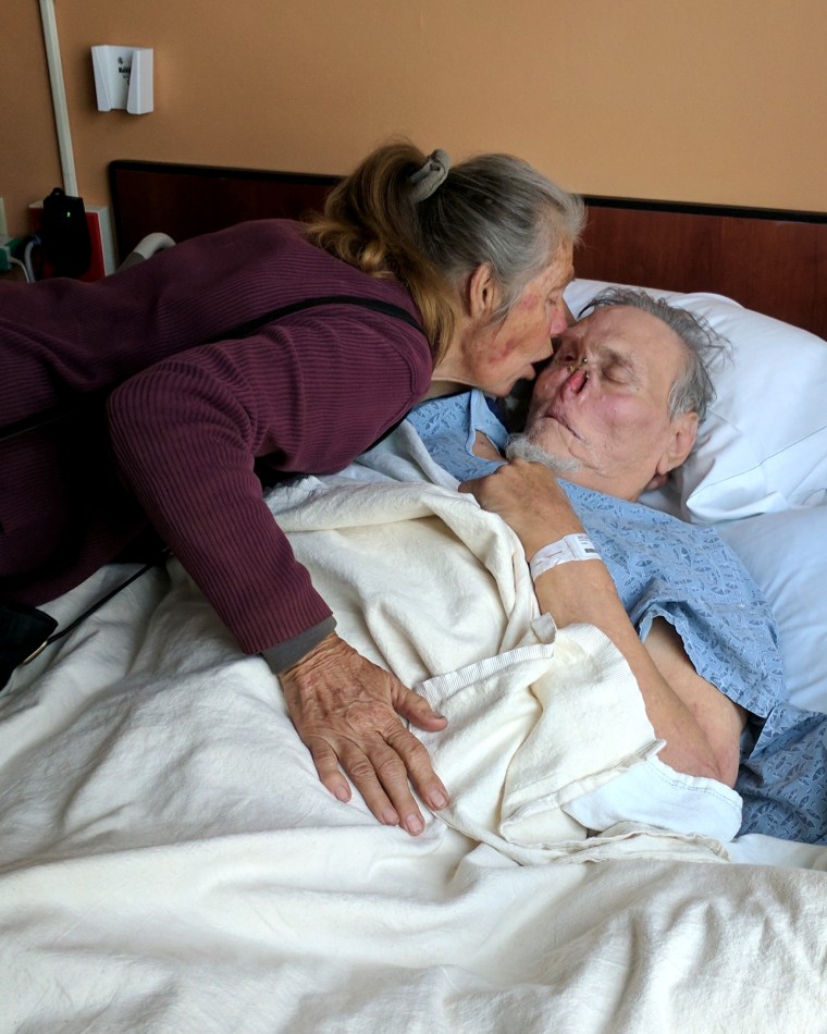 Image: LaDonna kisses St. James during a hospital stay after he suffered a stroke.