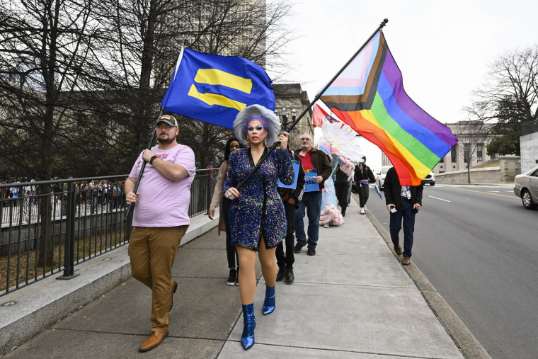 Trans rights activists march past the state Capitol during a protest of anti-drag laws in Nashville, Tenn.