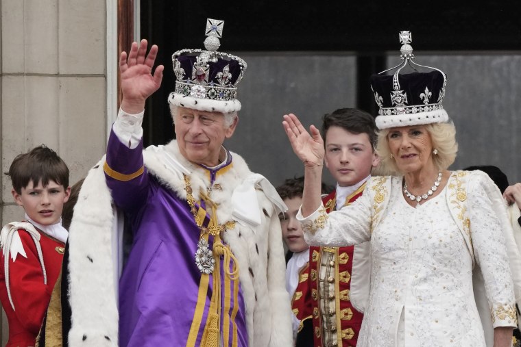 Britain's King Charles III and Queen Camilla wave to the crowds from the balcony of Buckingham Palace