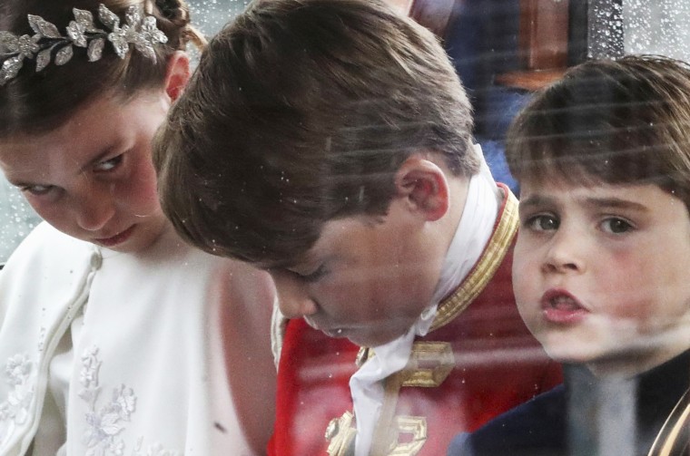 Princess Charlotte, Prince George, and Prince Louis sit in a coach