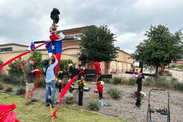 People put together a memorial for the victims of a mass shooting at a mall in Allen, Texas, on May 7, 2023.