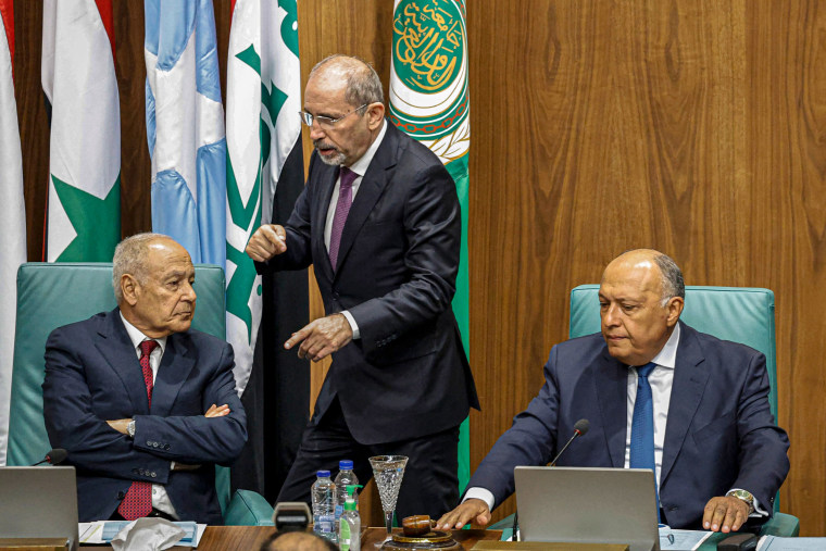 Jordan's Foreign Minister Ayman Safadi, center speaks with Arab League Secretary-General Ahmed Aboul Gheit, left, and Egypt's Foreign Minister Sameh Shoukry during an emergency meeting of Arab League in Cairo on May 7, 2023.