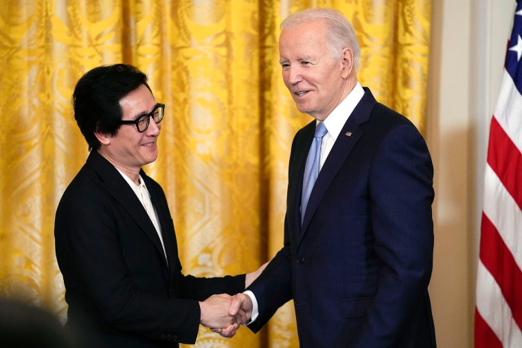 President Joe Biden shakes hands with actor Ke Huy Quan before a screening of the series "chinese born american" in the East Room of the White House in Washington.  The screening was in celebration of Asian American, Native Hawaiian and Pacific Islander Heritage Month, Monday, May 8, 2023. (AP Photo/Susan Walsh)