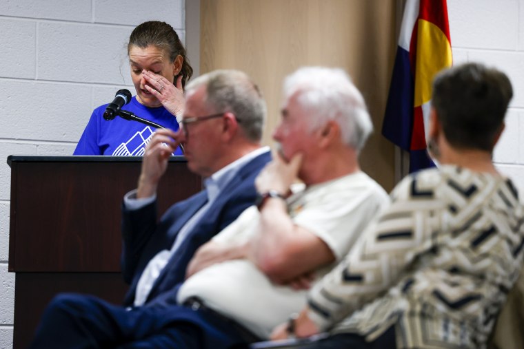 Woodland Park Middle School teacher and parent Amber Hemingson delivers an emotional speech to the Woodland Park Board of Education during their meeting on April 12, 2023 in Woodland Park, Colo.