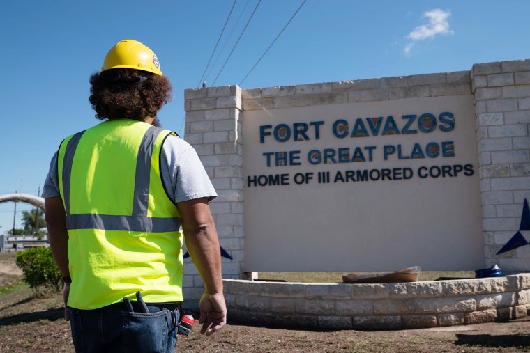 A government contractor in front of the Clear Creek access control point in preparations to rename the base Fort Cavazos.