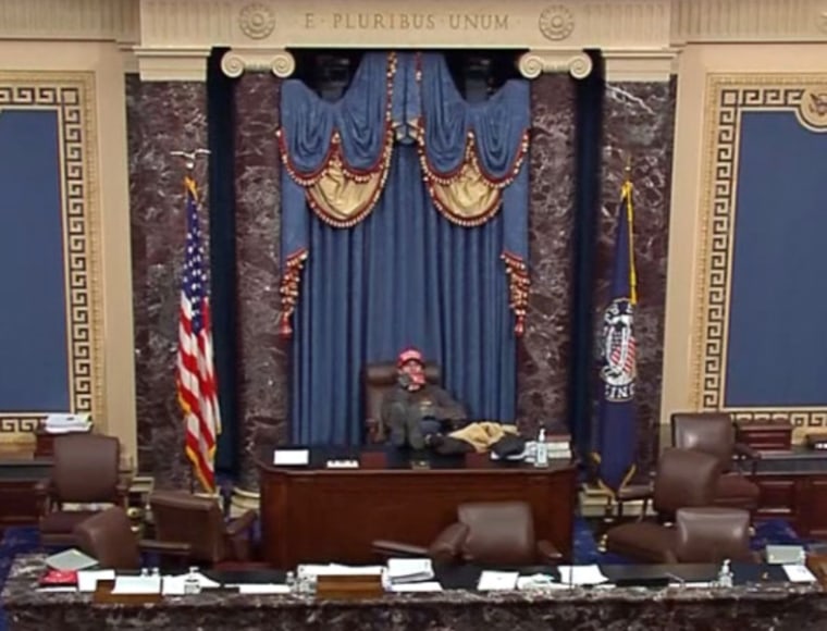 Bruno Joseph Cua sits in the Vice President’s chair in the House with  his feet up on the desk.  