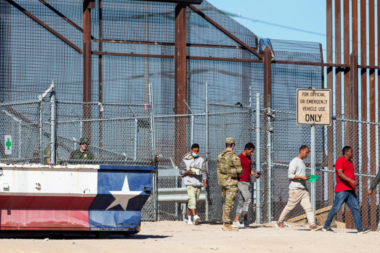 Migrants enter El Paso, Texas from Ciudad Juarez, Mexico on May 10, 2023.