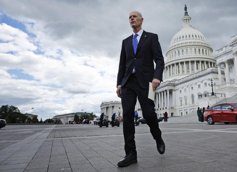 Sen. Rick Scott, R-Fla., walks out of the Capitol on May 3, 2023.