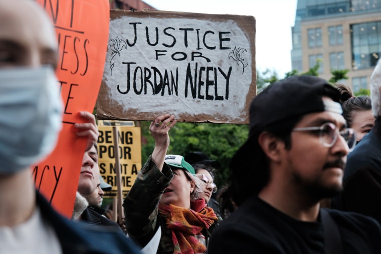 Protesters holding signs gather in Washington Square Park for a "Justice for Jordan Neely" rally in New York